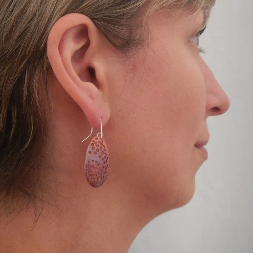 Spiral Hole Earrings Copper worn on model