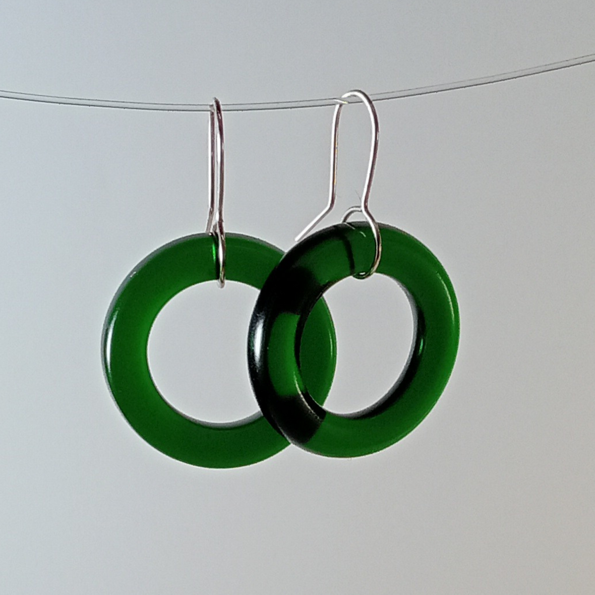 Emerald Hoop Earrings shown with less light