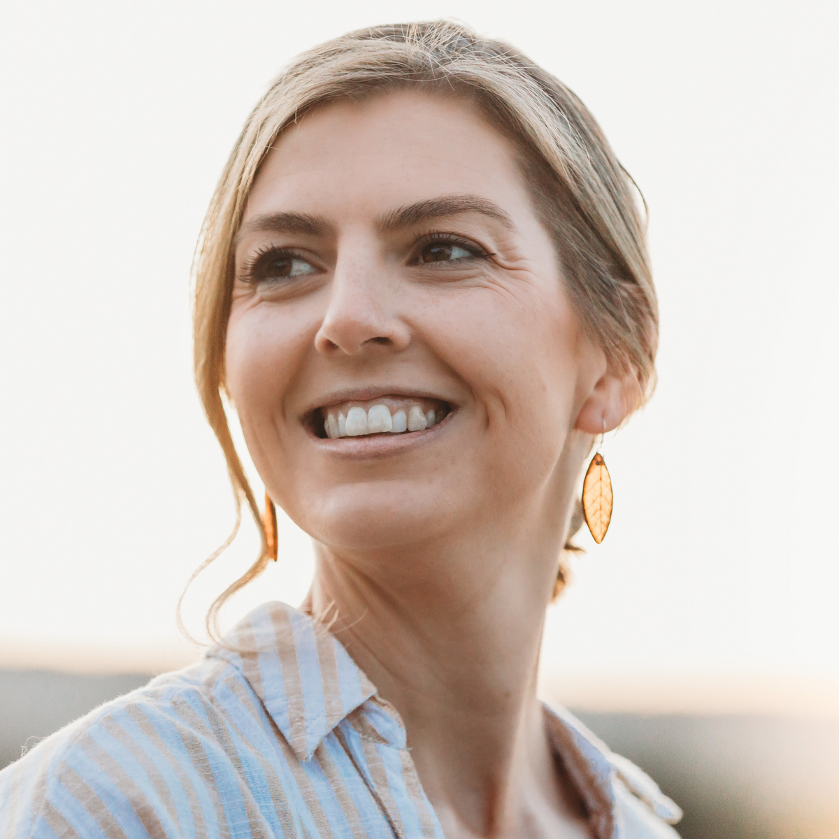 Leaf Skeleton Earrings Brown worn on model