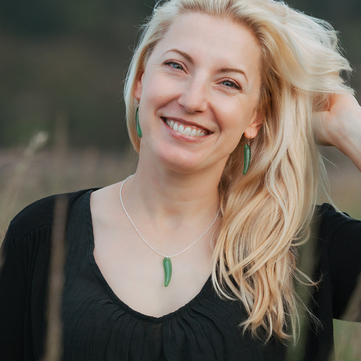 Silver Fern Pendant and Earrings Small Green worn on model