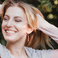 Copper Kōwhai Pod Earrings on model