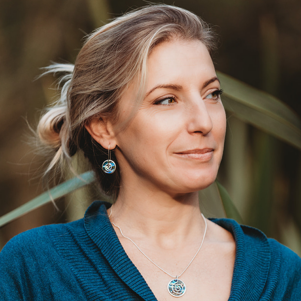Silver Pāua Spiral Drop Earrings Medium and Silver Paua Spiral Choker worn on model