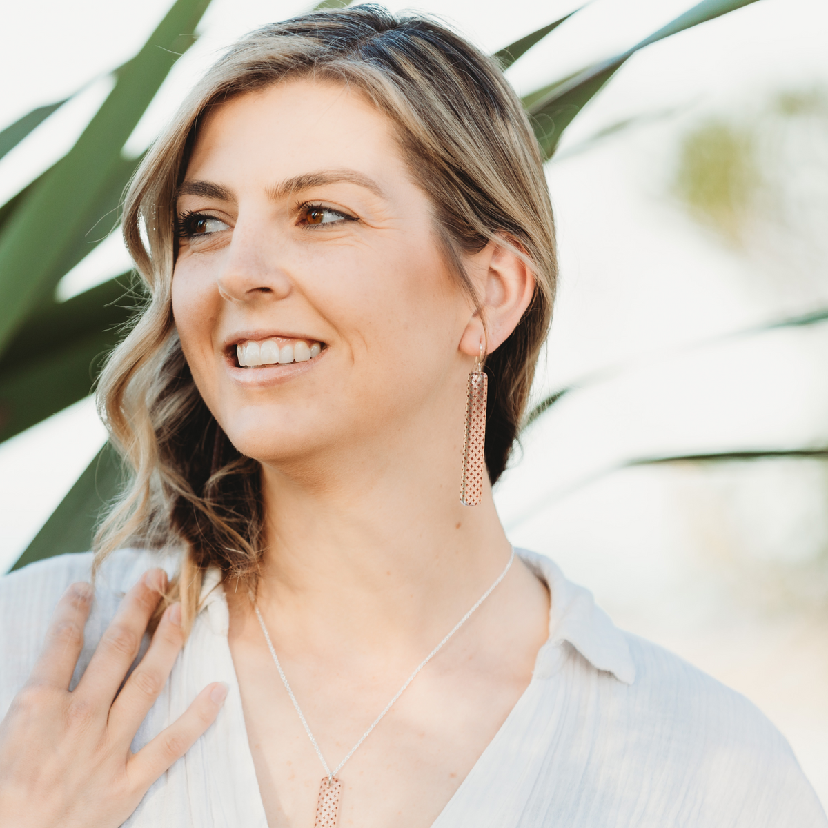 Woven Flax Long Drop Earrings Clear worn on model