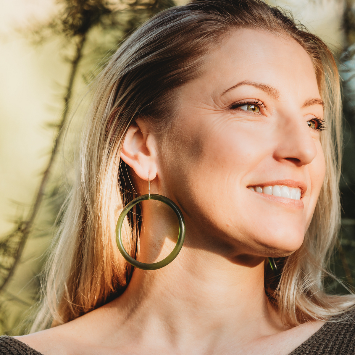 Large Hoop Earrings Green worn on model