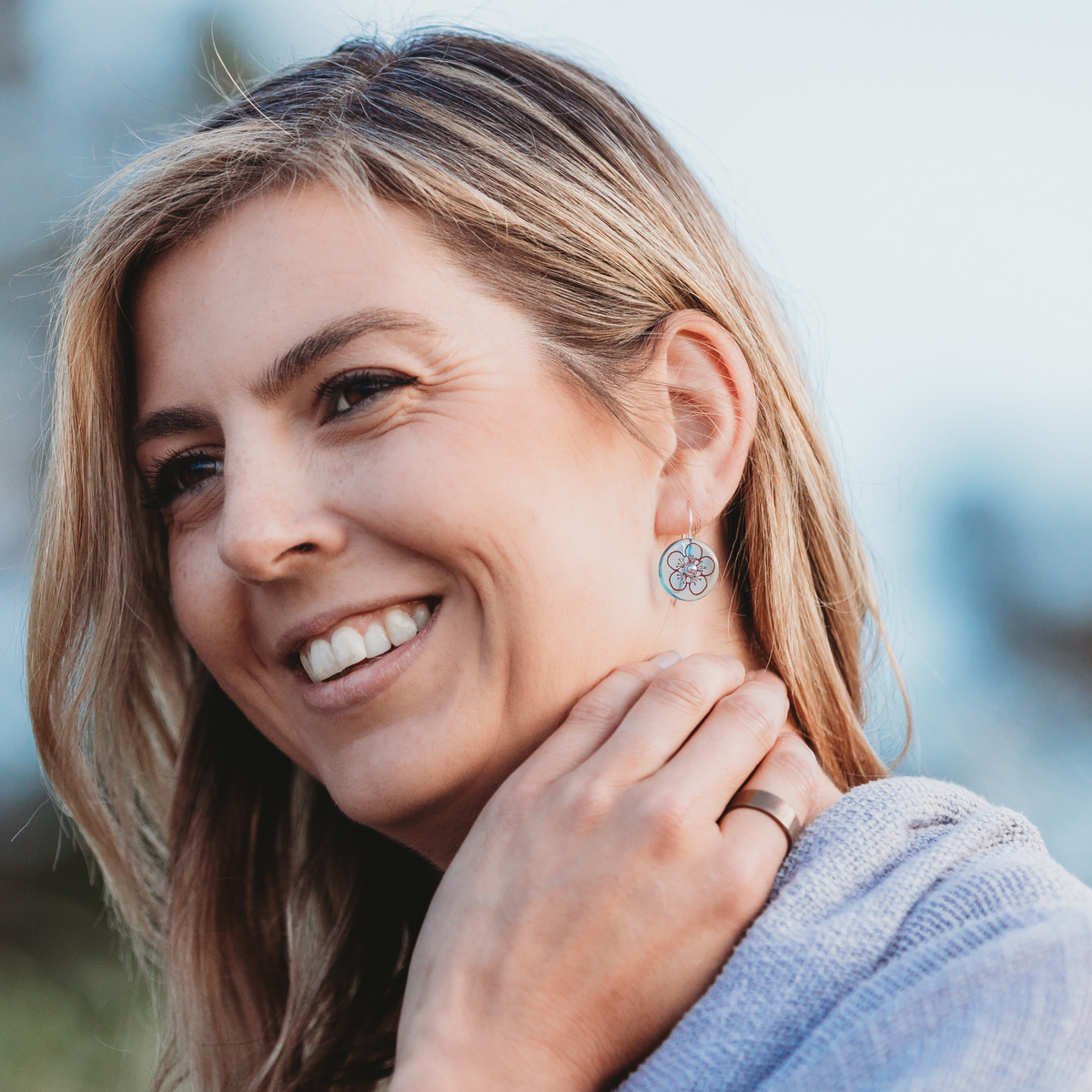Manuka Disc Earrings Light Blue worn on model