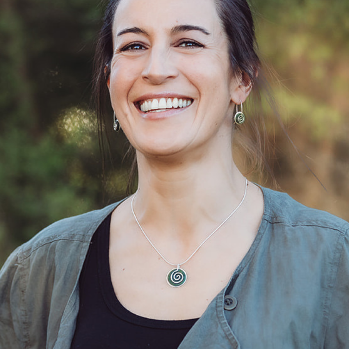 Silver Greenstone Spiral Choker with matching small earrings worn on model