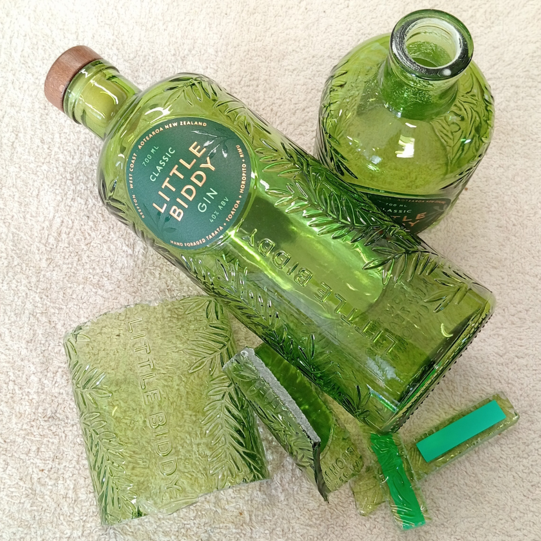 Little Biddy Gin bottles and pieces of glass 