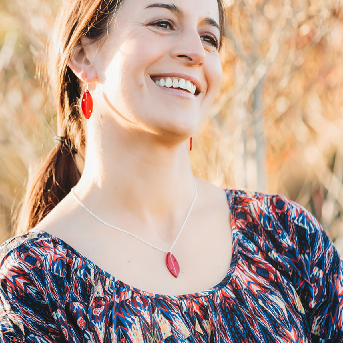 Pōhutukawa Leaf Pendant Necklace Red worn on model