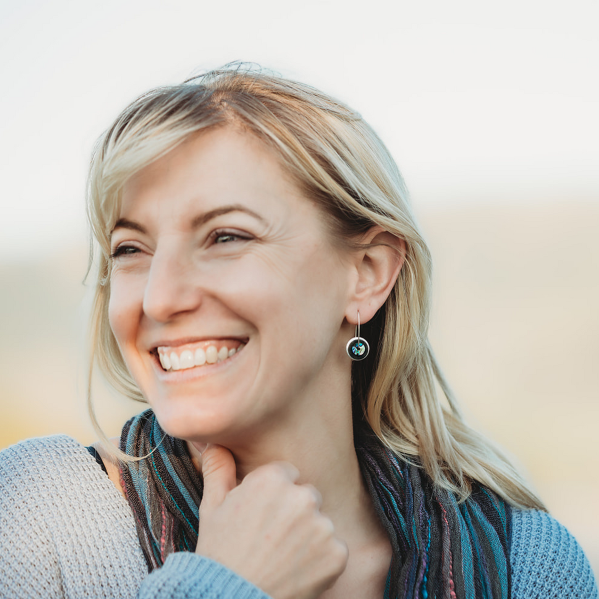 Silver Greenstone Pāua Drop Earrings worn on model