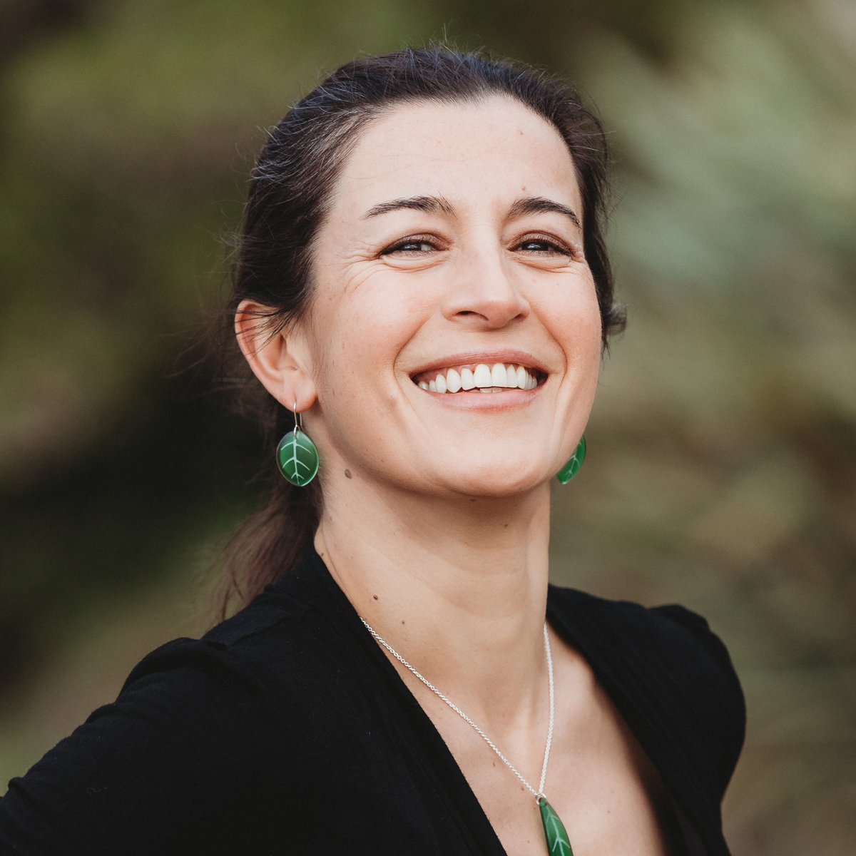 Puka Leaf Earrings Green worn on model with Tawa Leaf Green Necklace