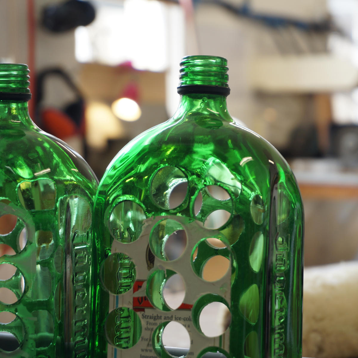 Jägermeister bottles with discs drilled out