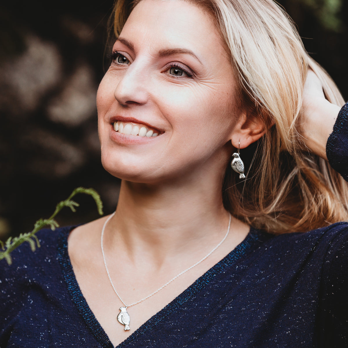 Kererū Earrings and Necklace on model
