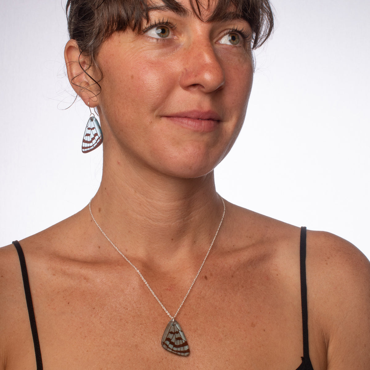 Butterfly Wing Earrings and Pendant Light Blue on model