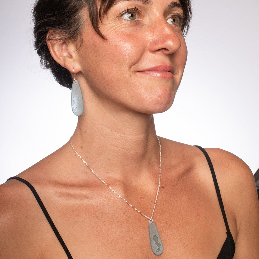 Fantail Teardrop Earrings and Pendant Light Blue worn on model