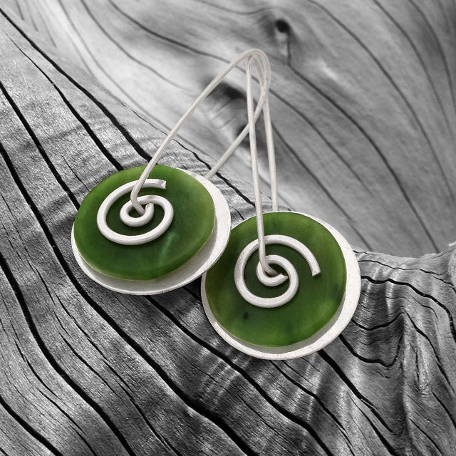 Silver Greenstone Spiral Drop Earrings on driftwood