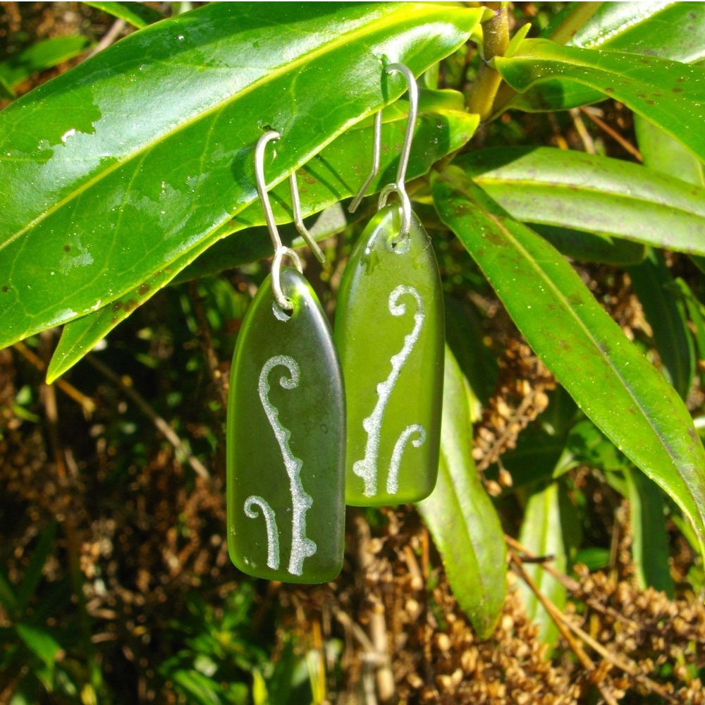 Glass Fern Frond Earrings on leaf